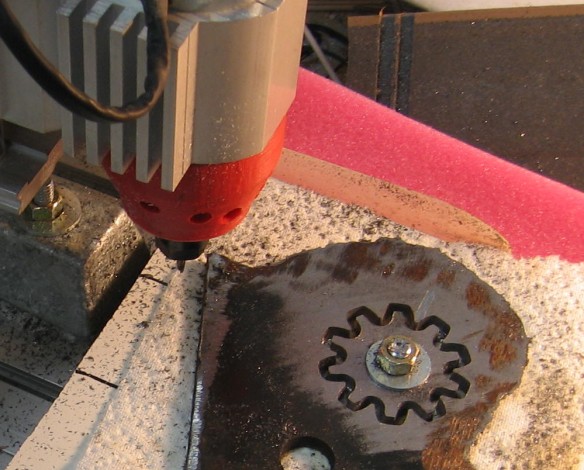 My aluminum CNC router has just cut a #40 roller sprocket from 1/4" steel plate, using a 1/8" carbide end mill.